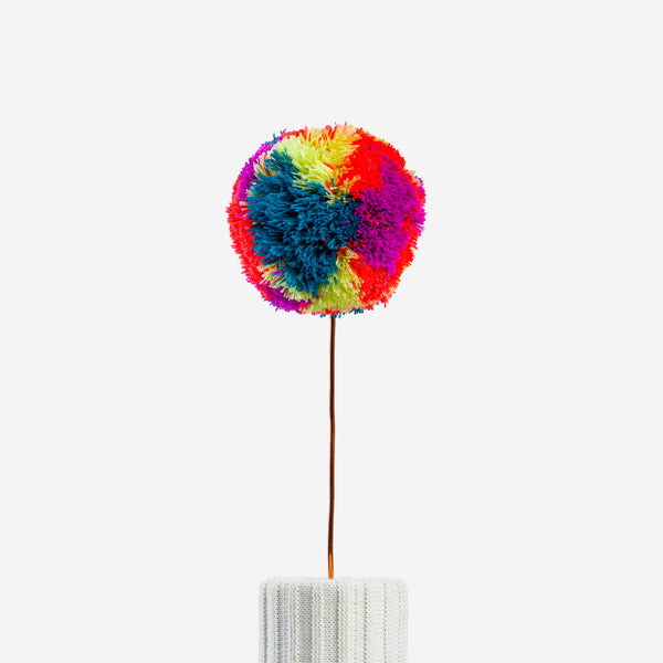 Magenta Lime | knitted pom pon home decor that is orange purple and yellow