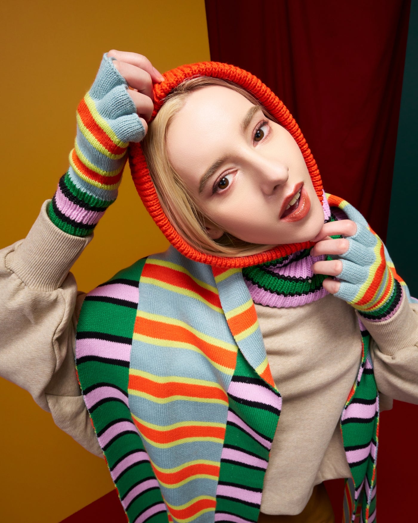 matching striped fingerless gloves knit hood and oversized scarf on model