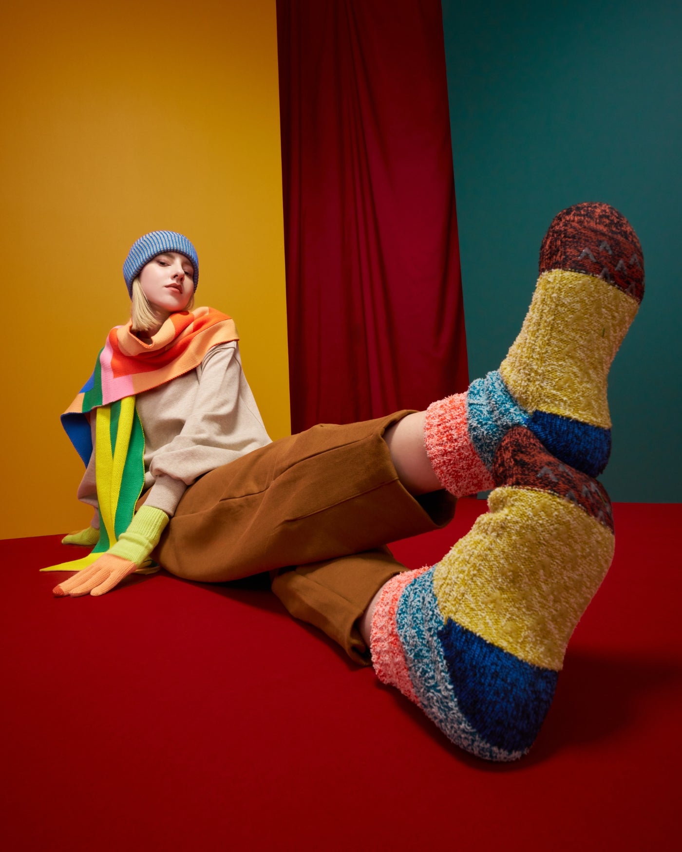 plush knit house socks and graphic scarf on a model