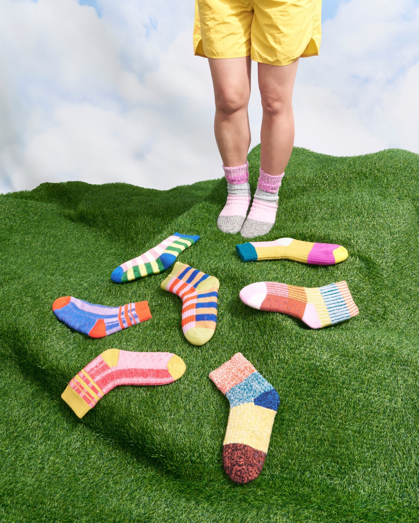 bestselling fleece lined knit house socks slippers on a grassy turf