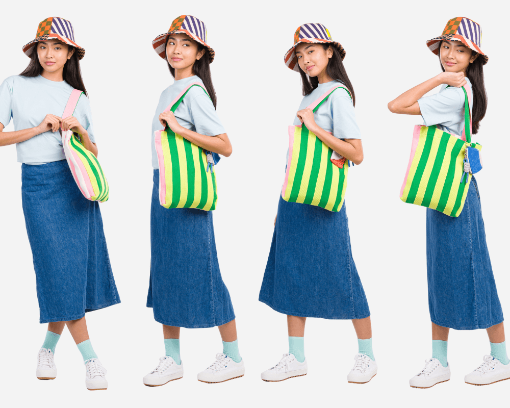 model wearing a summery striped bag and patchwork bucket hat