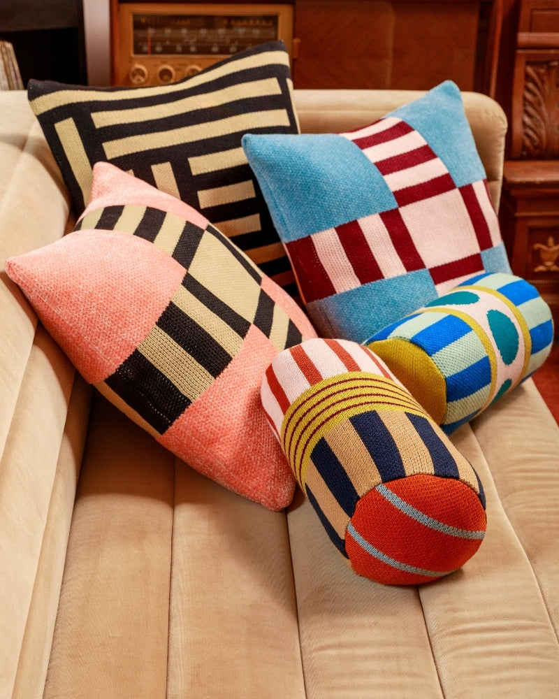 colorful knit pillow covers and bolster pillows knit with repurposed deadstock yarn