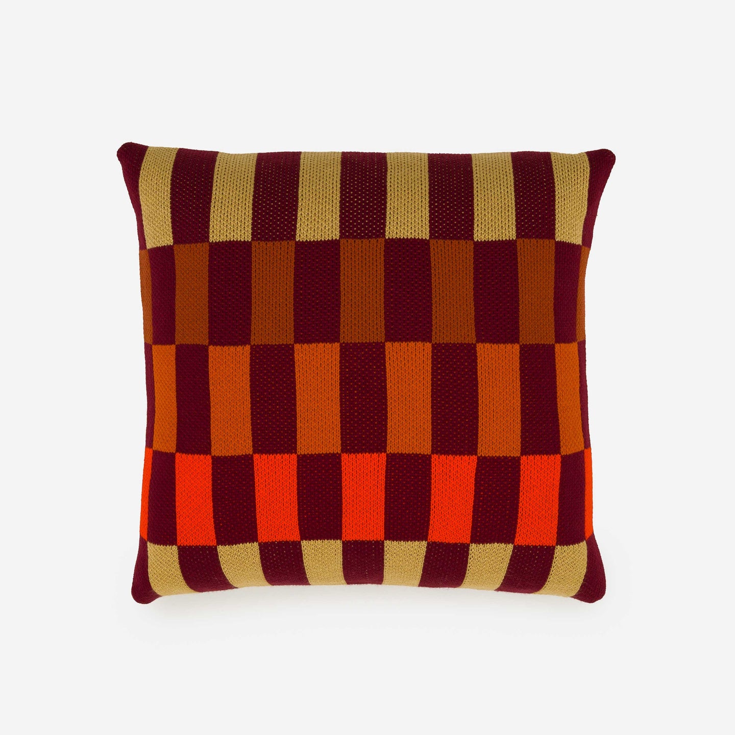 knit pillow cover with checkerboard design using dark tone colors